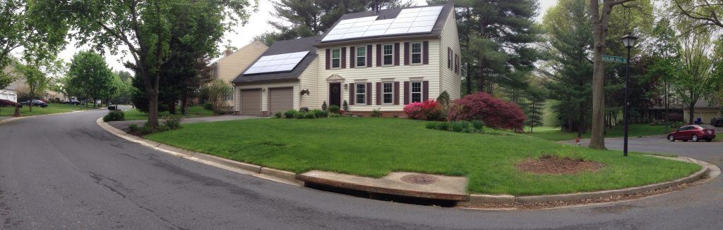 house with green lawn