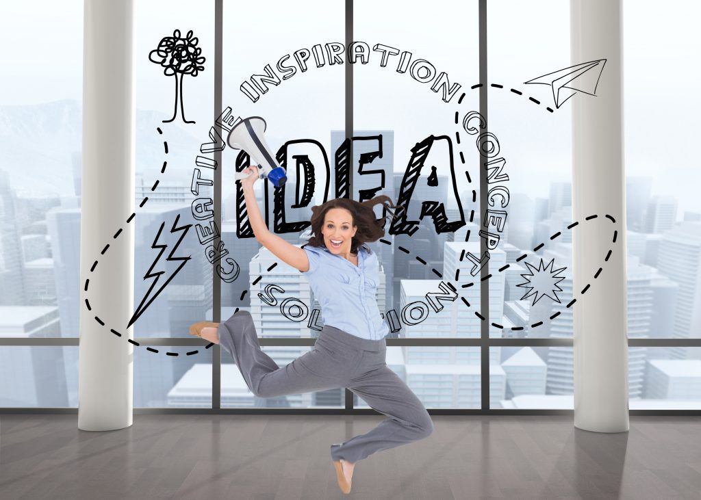 businesswoman jumping while holding megaphone